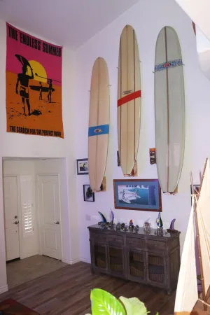 Vertical wood surfboard wall display rack